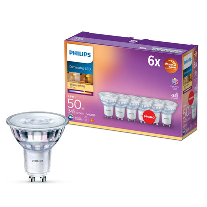 Philips LED GU10 spotpære 345 lm dæmpbar varm hvid 6-pak vist foran lilla og orange emballage.
