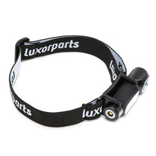 Luxorparts Multifunktionslampe 500 lm sort kompakt pandelampe med justerbar elastisk rem og cylindrisk design.