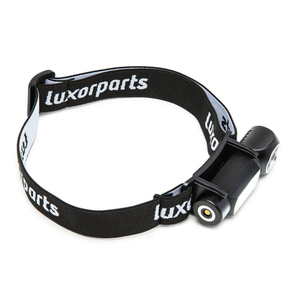 Luxorparts Multifunktionslampe 500 lm sort kompakt pandelampe med justerbar elastisk rem og cylindrisk design.