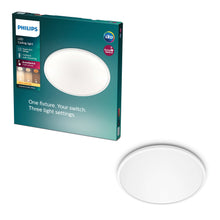 Philips Mauve Sceneswitch LED loftlampe 1500 lm ved siden af emballage med info om 3-trins dæmpbar varm hvid belysning.