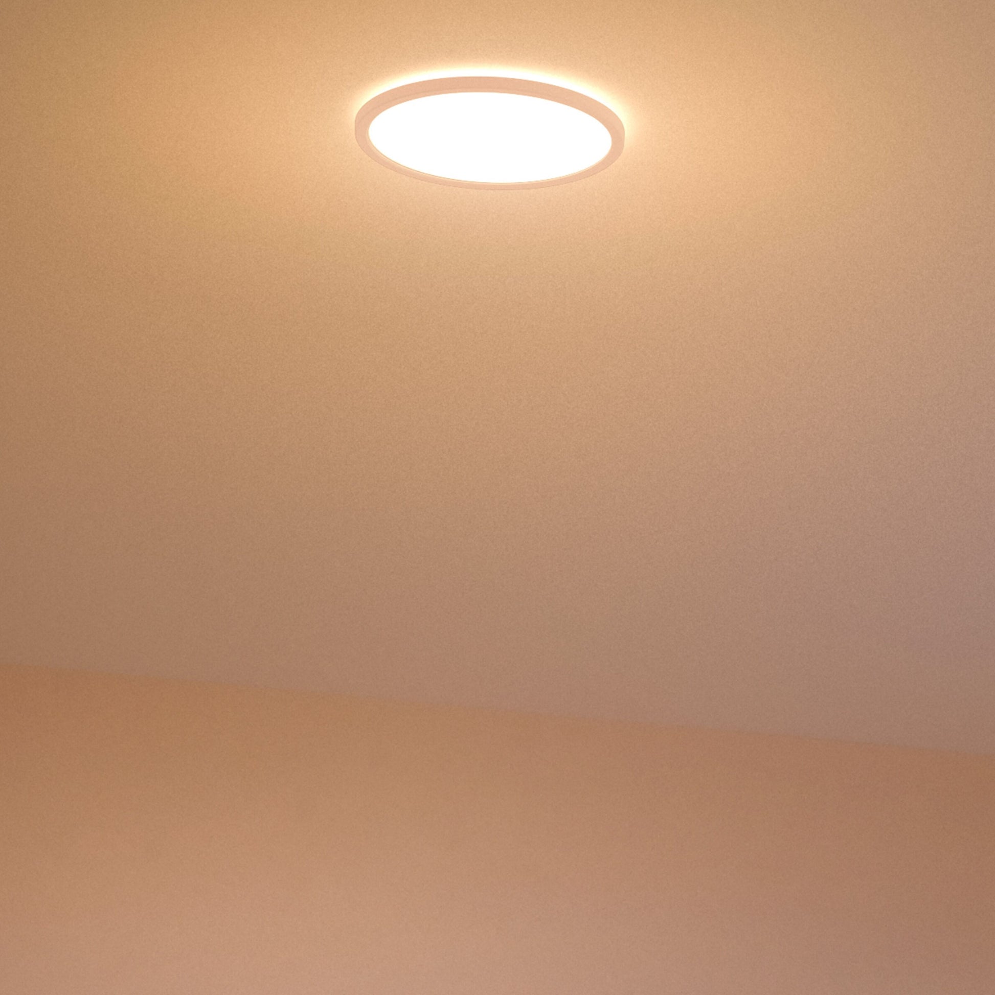 Philips Mauve Sceneswitch LED loftlampe, rund, indbygget, 1500 lm, varm hvidt lys på beige loft og væg.