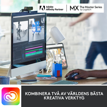 Logitech MX Keys Mini trådløst tastatur grå brugt ved computer, Adobe og Logitech logoer samt tekst om kreative værktøjer vises.