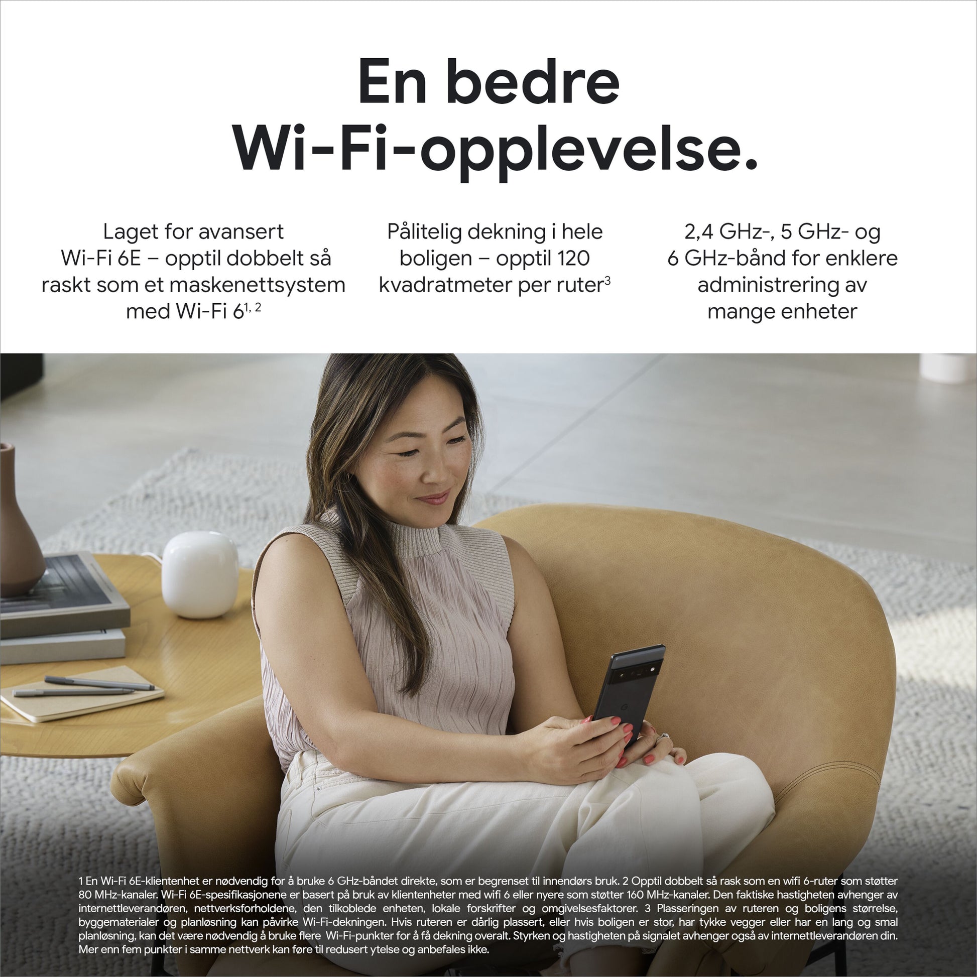 Google Nest Wifi Pro AXE4200 1-pakke WiFi 6E mesh-router står på bord i stue ved sofa brugt med smartphone.