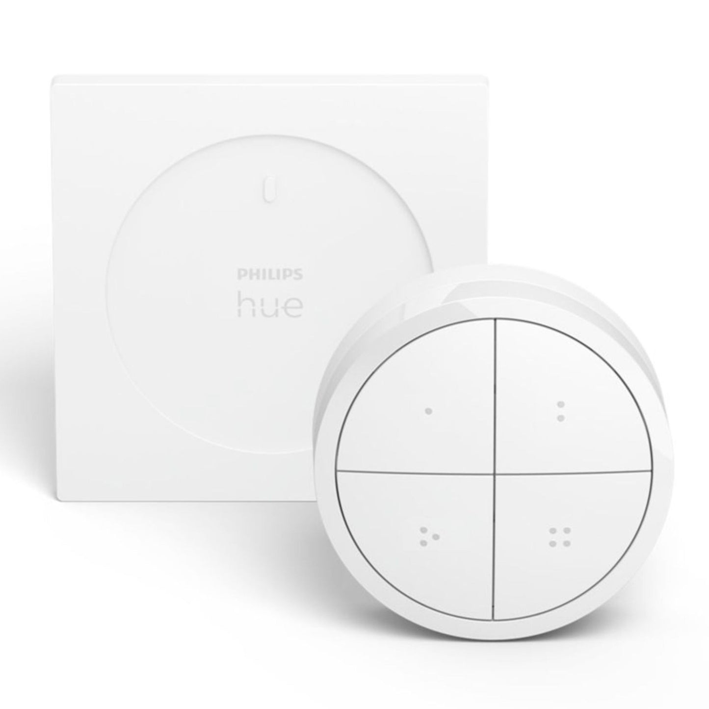 Philips Hue Tryk på Drejeknap Fjernbetjening hvid bag firkantet Philips Hue bridge med prikkede kvadrantdetaljer.