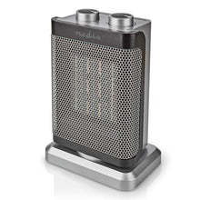 Keramisk varmeblæser 1500 W med to sølvknapper, sølvfarvet base, termostat og overophedningsbeskyttelse.