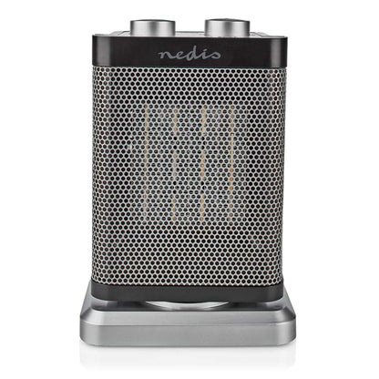 Nedis keramisk varmeblæser 1500W, rektangulær, metalgitter foran, to kontrolknapper på toppen, sølvfarvet bund.
