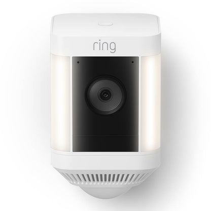 Ring Spotlight Cam Plus Battery trådløs overvågningskamera hvid med sort linse, dobbelte sidelys og 1080p Full HD.