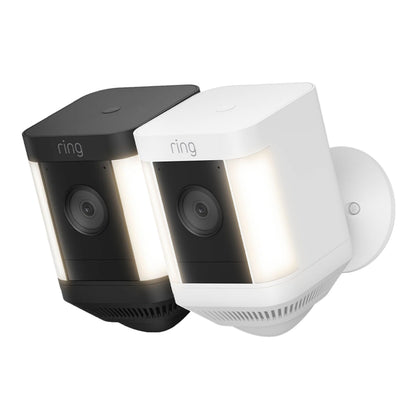 Ring Spotlight Cam Plus Battery trådløs overvågningskamera sort og hvid, indbygget lys, vidvinkelobjektiv, 1080p udendørs.