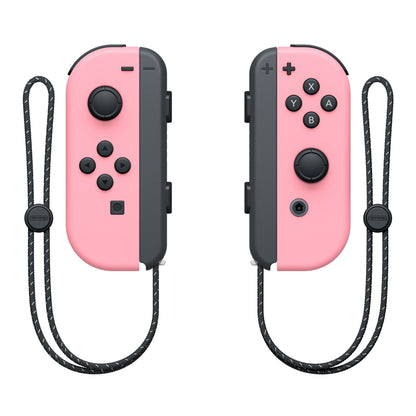 Nintendo Joy-Con par i lyserød med sorte knapper og håndledsrem, venstre med D-pad, højre med actionknapper.