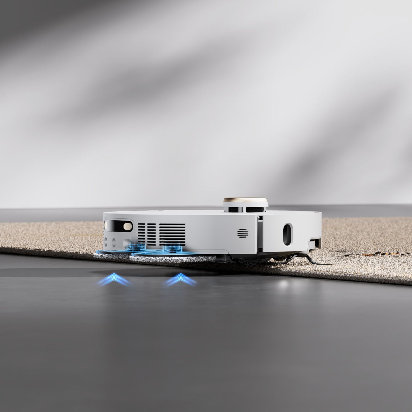 Dreame X40 Ultra fuldautomatisk støvsugerrobot skifter fra hårdt gulv til tæppe og lyser blåt under rengøring.