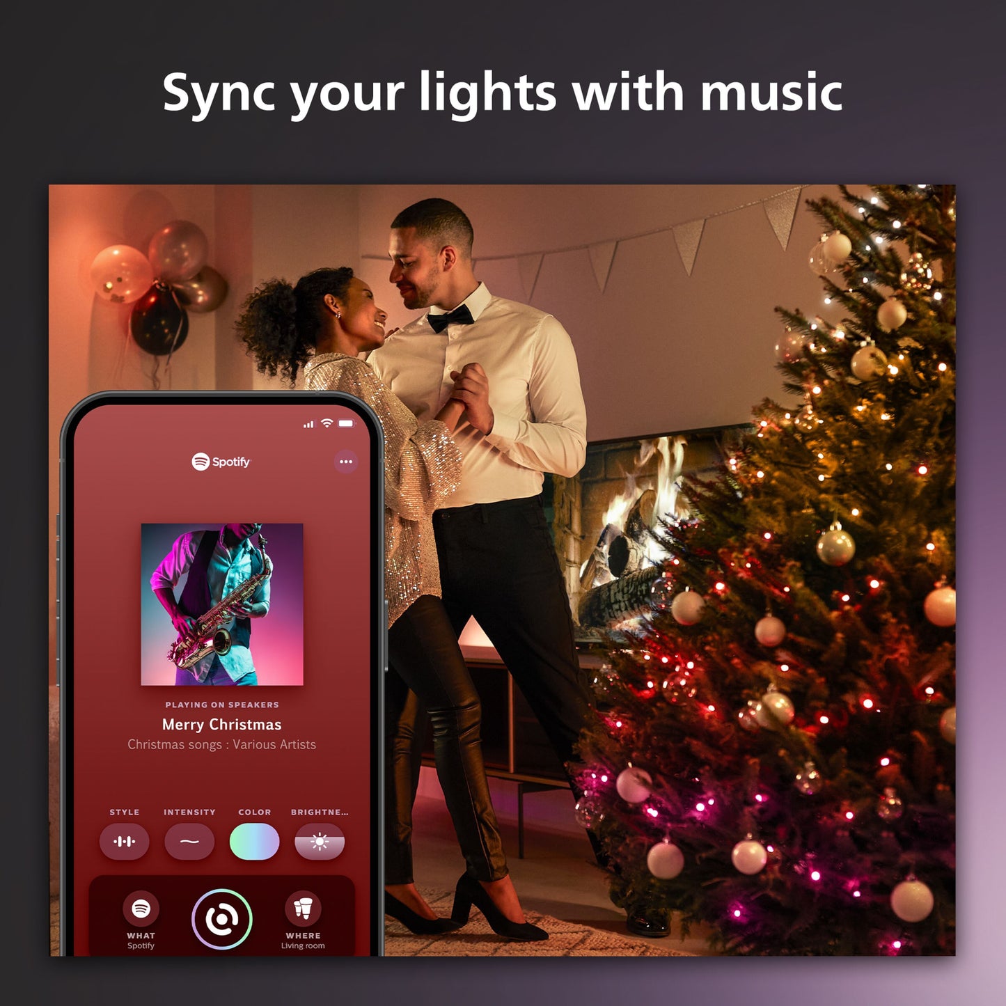 Philips Hue Festlig lyskæde 250 LED med farvegradient i brug, Spotify-app synlig på mobil.