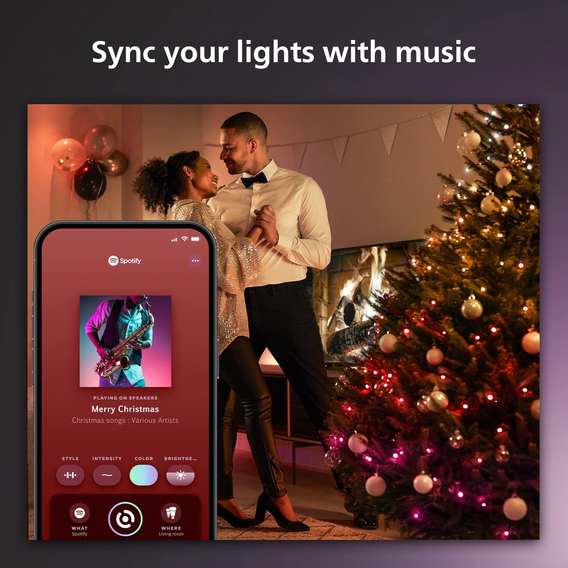 Philips Hue Festlig lyskæde 250 LED med farvegradient i brug, Spotify-app synlig på mobil.