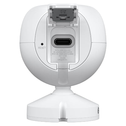 Ubiquiti G4 Instant overvågningskamera bagfra med USB-C port, reset-knap, topklap og cirkulær base.