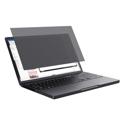 Trust Privatlivsfilter til bærbar 15,6", sort filter delvist monteret på sort laptop, tastatur og kanter synlige.