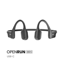 Shokz OpenRun Mini trådløse sorte øretelefoner med benledningsteknologi, wraparound-bånd, USB-C, tekst: OPENRUN Mini USB-C.