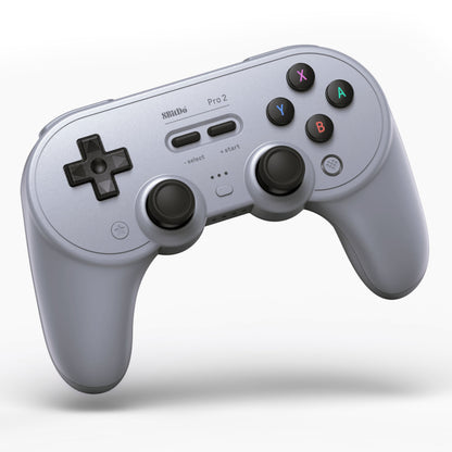 8Bitdo Pro 2 Bluetooth Hall Edition håndkontrol grå med Hall-effektsensor, dobbelte analoge styrepinde og farvede knapper.