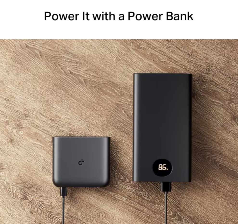 TP-Link TL-WR1502X Travel Router AX1500 WiFi 6 tilsluttet sort powerbank med display 86 via kabel, tekst "Power It with a Power Bank for fleksibelt internet.