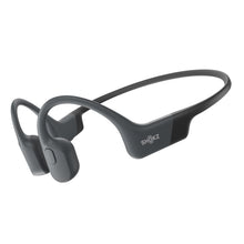 Shokz OpenRun trådløse benledning-hovedtelefoner USB-C sorte, buet bøjle og ørestykker foran ørerne.