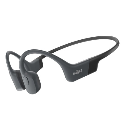 Shokz OpenRun trådløse benledning-hovedtelefoner USB-C sorte, buet bøjle og ørestykker foran ørerne.