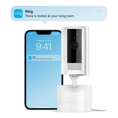 Ring Pan-Tilt indendørskamera hvid foran smartphone med bevægelsesnotifikation og farve-nattesyn, kl 9:41 d. 6/6.