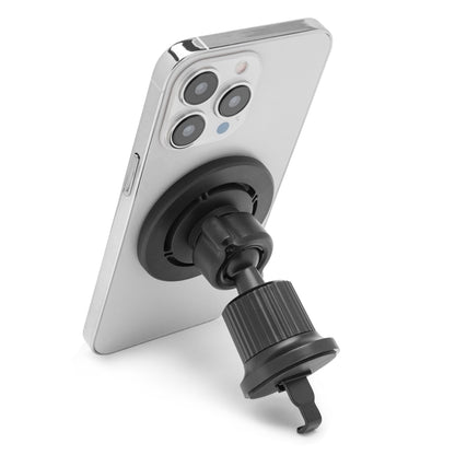 Sølvfarvet smartphone i Magnetisk mobilholder til bil, monteret på bilventilationsudtag, holderen synlig bag telefonen.