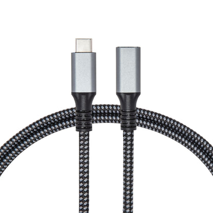 USB-C forlængerkabel 1 m flettet sort/grå med USB-C stik og 3,5 mm jack adapter, understøtter op til 100 W opladning.