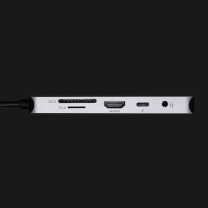 Plexgear USB-C Multiadapter 100W passthrough 9 porte med SD, microSD (TF), HDMI, hovedtelefonstik tæt på vises.