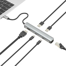Plexgear USB-C Multiadapter 6 porte sølv tilsluttet laptop med HDMI 4K, RJ45 netværk, USB-A og USB-C stik.