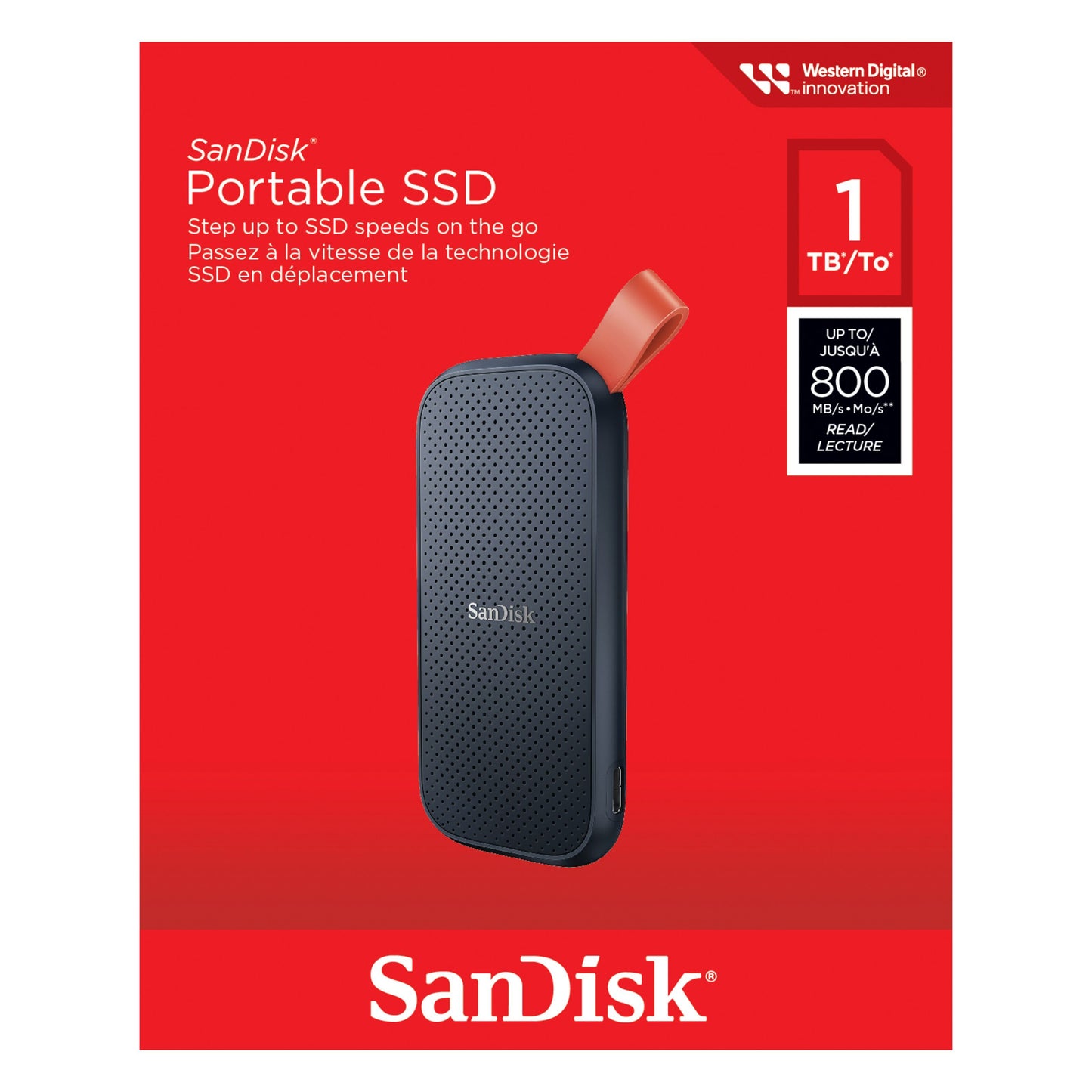 Sandisk Bærbar SSD 1TB med rød rem, USB-C, op til 800 MB/s, Sandisk-logo øverst til højre på rød emballage.