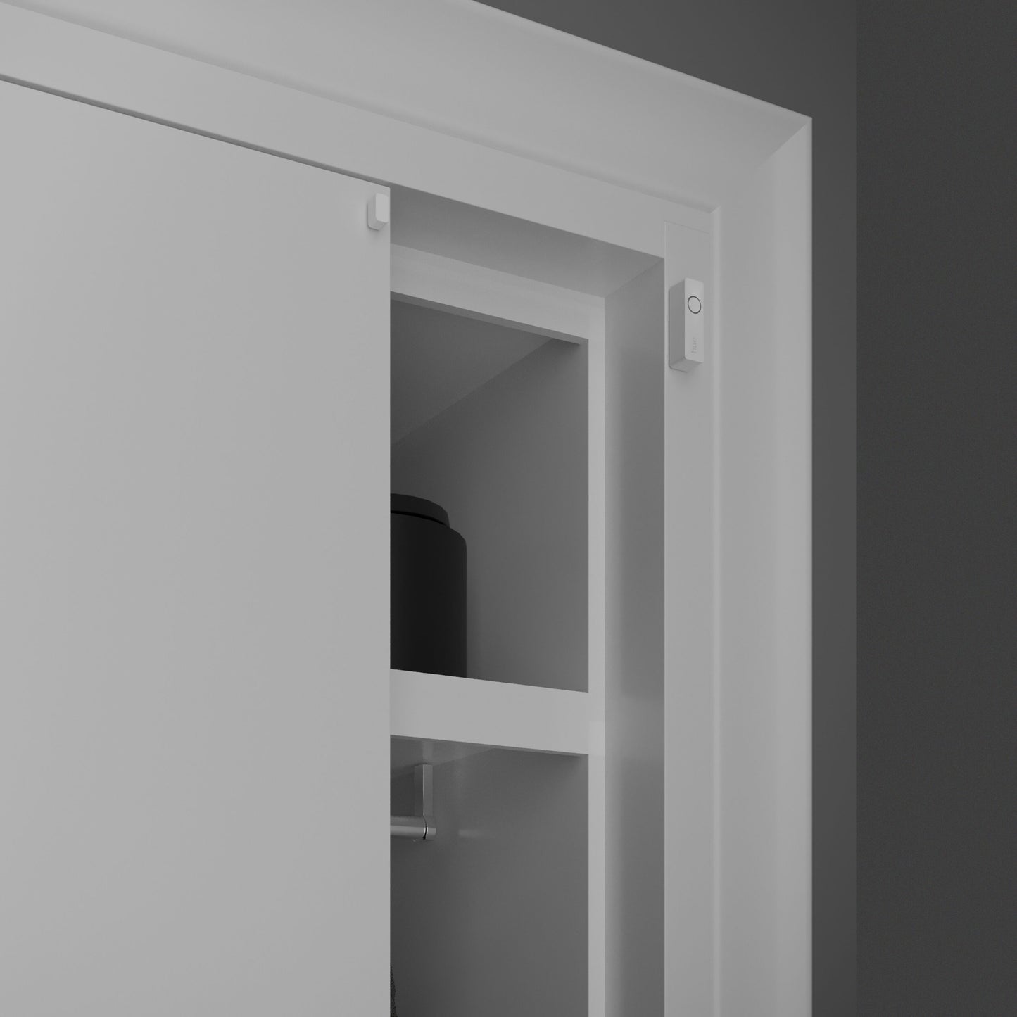 Philips Hue Sikker kontakt sensor Hvid 1-pak monteret på hvid dørkarm ved gråt skab, delvis åben skydedør.