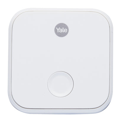 Yale ConnectX Wi-Fi-bro, hvid, kvadratisk med afrundede hjørner, central rund knap og Yale-logo øverst.