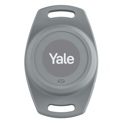Yale nøglebrik oval grå med hvidt Yale logo til Smart åbner motoriserede garageporte, klar til nøglering eller snor.