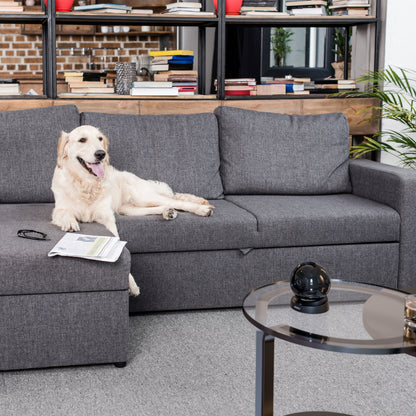 Imou Rex 3D 5 MP trådløst indendørskamera på hylde i stue nær glas, avis og sofa med golden retriever.