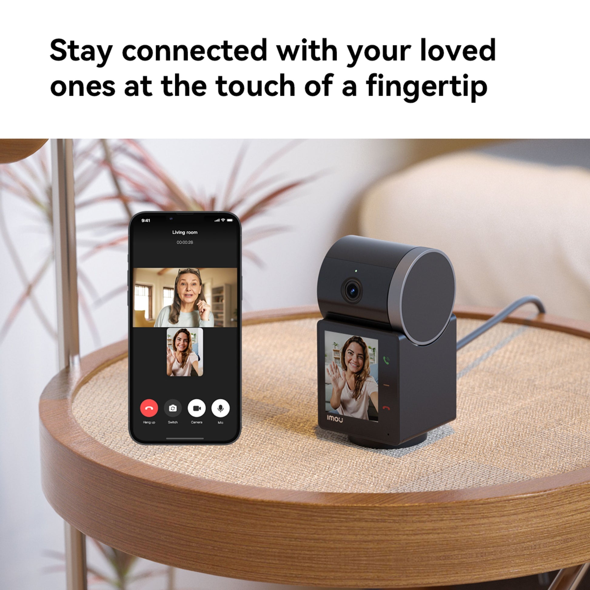 Imou Rex VT Pro 5 MP Trådløs indendørskamera ved siden af smartphone med videoopkald, Imou-logo synligt.