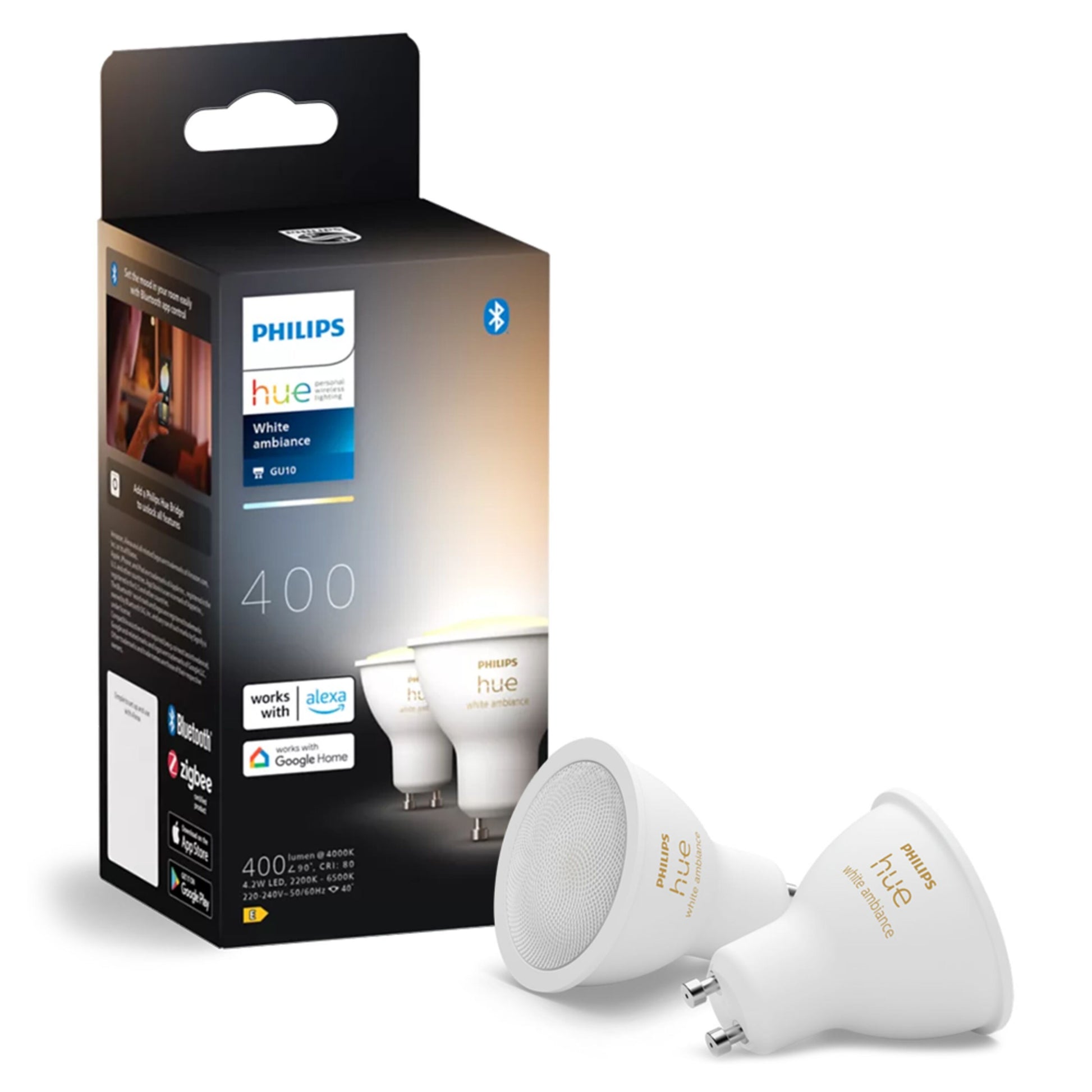Philips Hue White Ambiance Smart LED-pære GU10 400 lm 2-pak foran sort æske, Alexa og Google Home logo synlige.