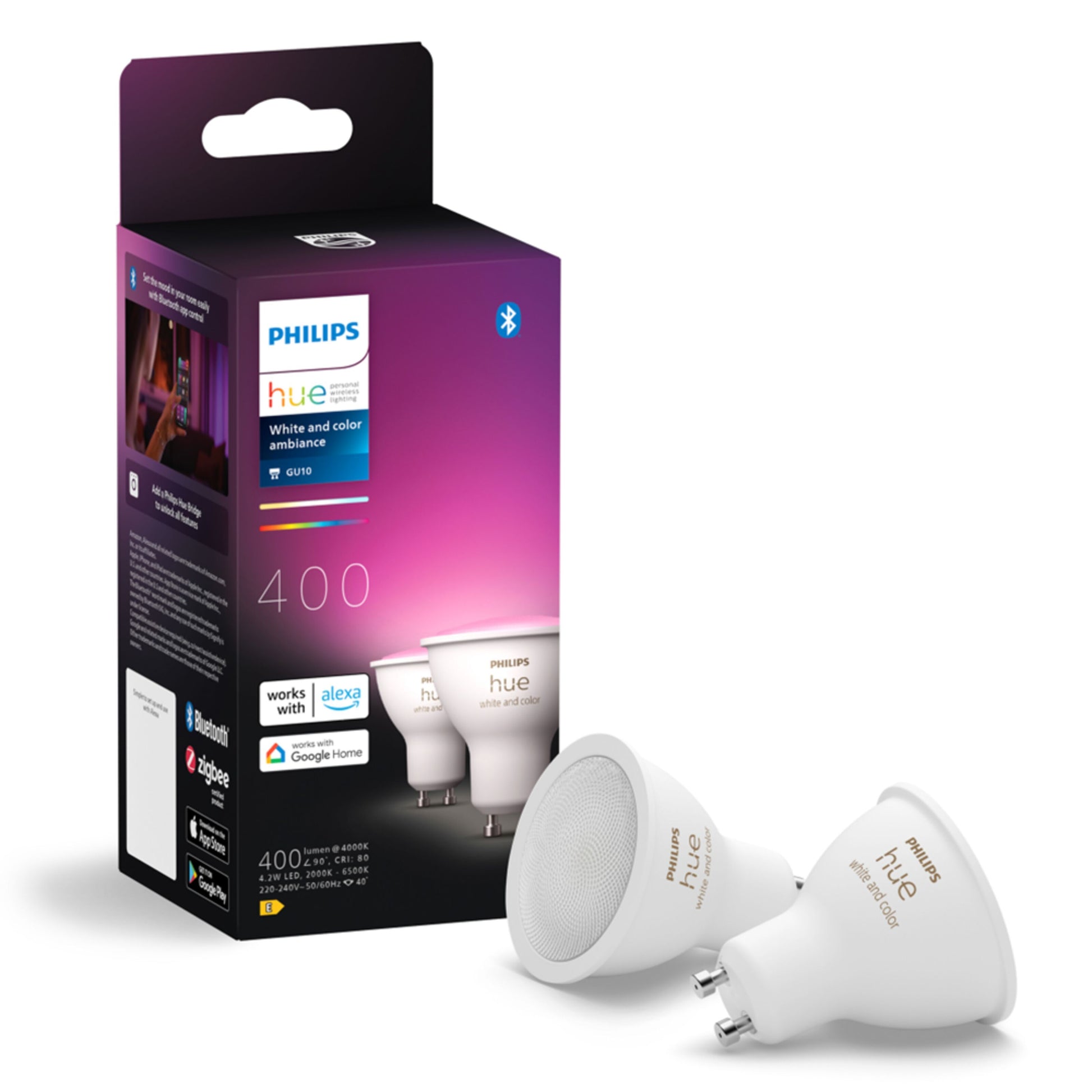 Philips Hue White and Color Ambiance smart LED-pære GU10 400 lm 2-pak med Alexa og Google Home-logo, til hvide pærer foran æsken.