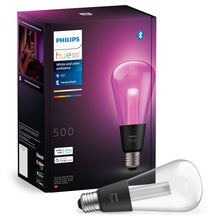 Philips Hue RGB ST72 smart LED-pære E27 500 lm lyser pink ved siden af emballage, kompatibel med Alexa og Google Assistant.