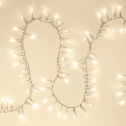AV-Cables.dk Lyskæde 700 LED klar 14 m, klare pærer i buet linje, lys beige baggrund.