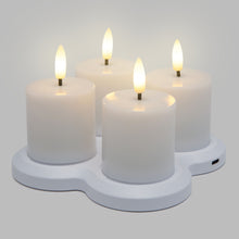 LED Varmelys genopladelige 4-pak, fire flammeløse bloklys med realistisk lys på hvid USB-C opladningsbase.