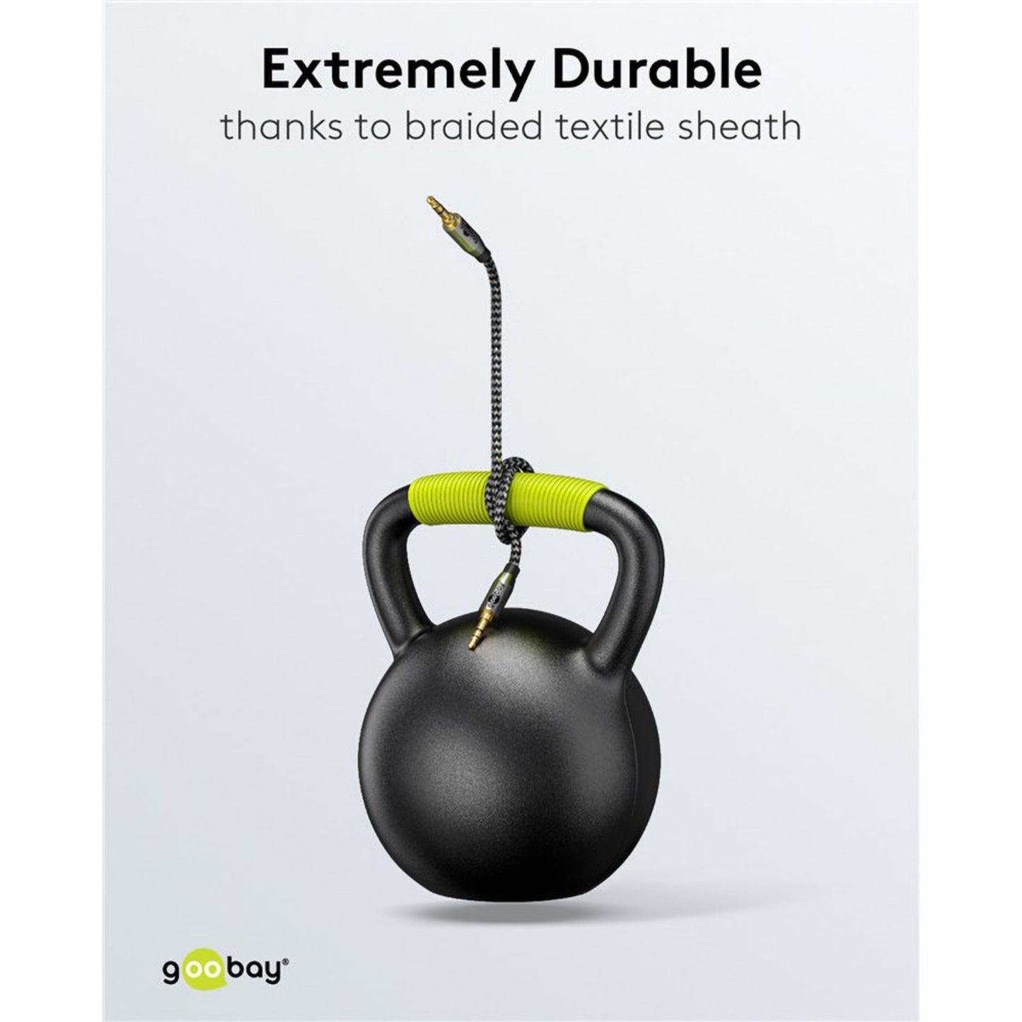 Goobay AUX-lydkabel 3,5 mm 1 m sort med flettet tekstil, viklet om sort kettlebell med grøn hank, Goobay-logo nederst.