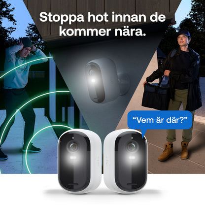 Arlo Essential 3 2K trådløs overvågningskamera 2-pak aktiveret om natten, begge kameraer synlige i forgrunden.