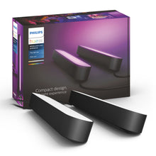 Philips Hue Play lyslister 2-pak sort foran original lilla-sorte æske med billede af farvet stemningsbelysning.