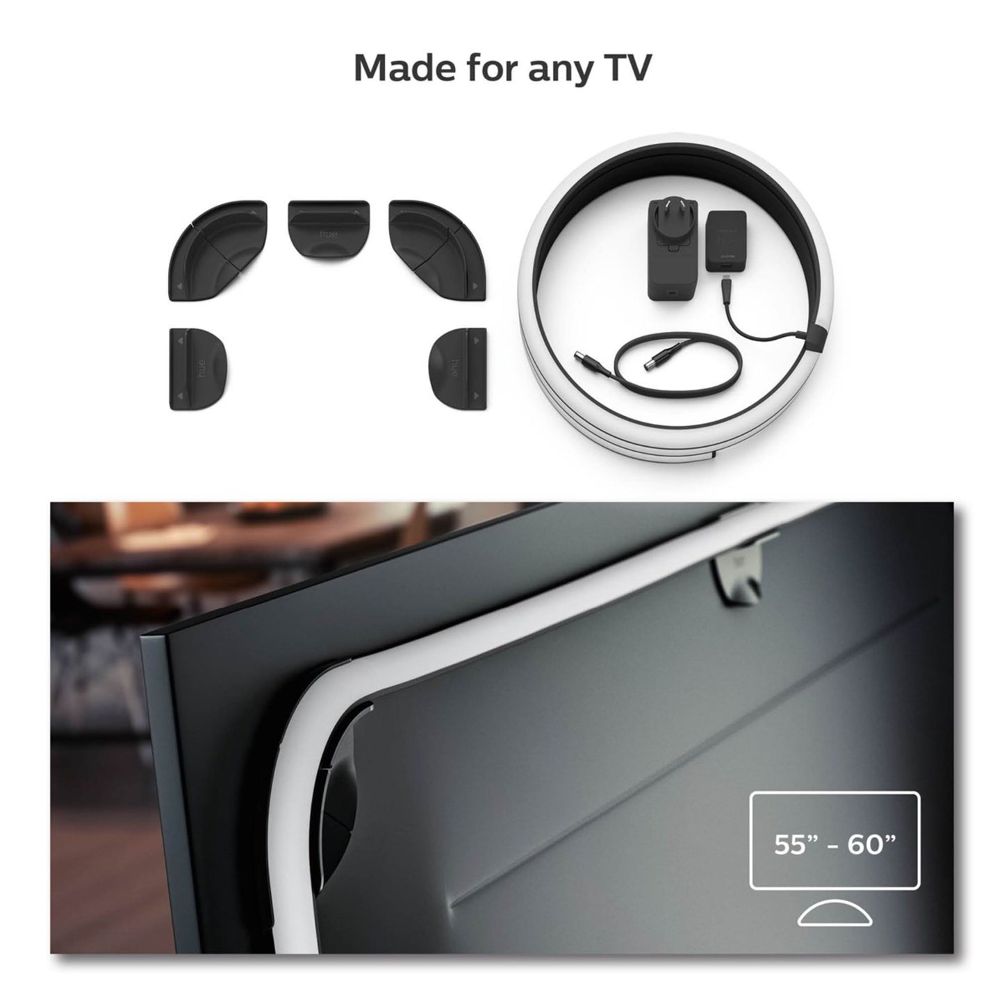 Philips Hue Play Gradient Lightstrip til TV 55", inkl. lysstrips, strømadapter og stik, monteret på 55-60" TV.