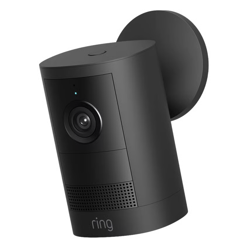 Ring Outdoor Cam Plus Battery Retinal 2K sort overvågningskamera til vægmontering, linse og indikatorlampe synlige, Ring-logo nederst.