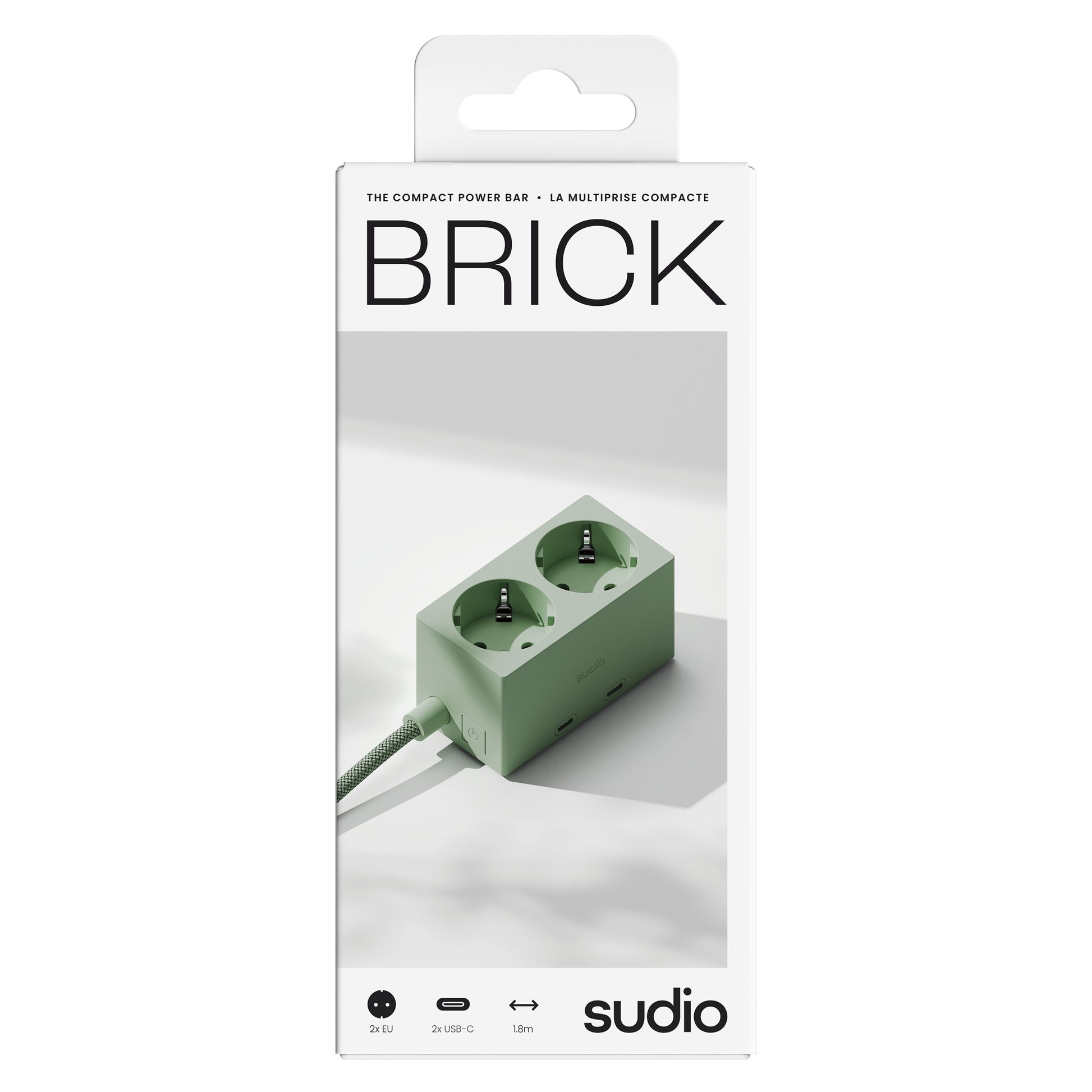 Sudio Vægadapter GaN 30 W grøn, flettet kabel, til udtag, emballage med Sudio-logo på fronten.