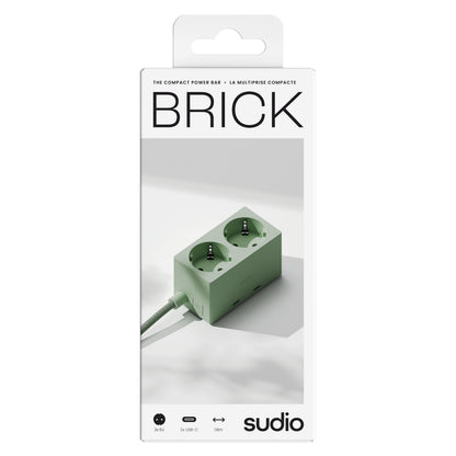 Sudio Vægadapter GaN 30 W grøn, flettet kabel, til udtag, emballage med Sudio-logo på fronten.