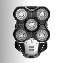 Remington Ultimate Series RX5 XR1500 barbermaskine topvinkel med fem runde blade og sølvfarvet tænd/sluk-knap.