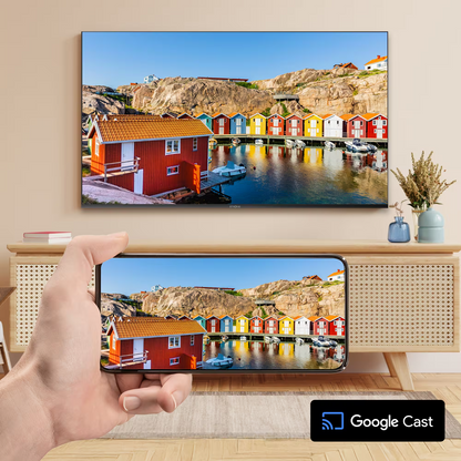 Strong LEAP-NOVA 4K Google TV Stick 32 GB streamer viser foto fra mobil spejlet på vægmonteret tv via Google Cast.