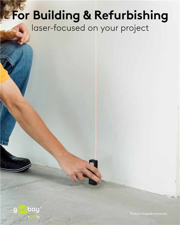 Goobay Laser afstandsmåler sigter mod hvid væg med synlig rød laserlinje.