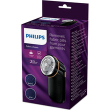 Philips GC026/80 fnugfjerner æske med enhed, før/efter-billeder, nøglefunktioner og 2 års garanti badge.
